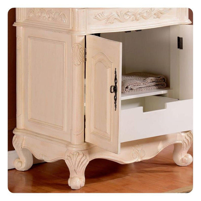 Ornate cream-colored cabinet with curved legs, open door revealing folded towels on shelf and decorative carved details.
