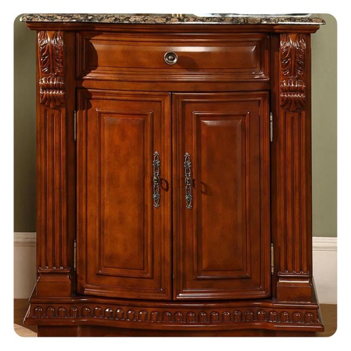 Rich mahogany cabinet with ornate carved columns, decorative marble top, and double doors with elegant metal handles.