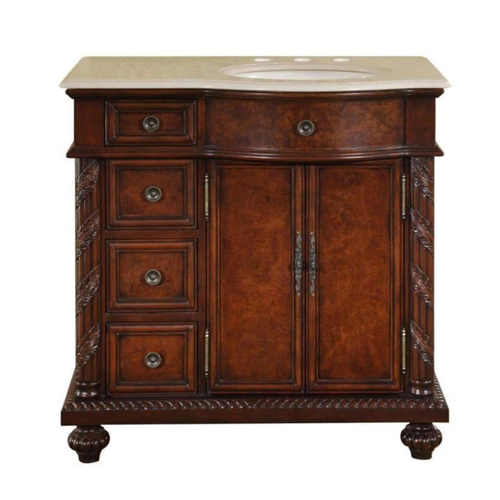 Rich mahogany bathroom vanity with ornate carved details, marble top, oval sink, and four side drawers.