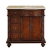 Rich mahogany bathroom vanity with ornate carved details, marble top, oval sink, and four side drawers.