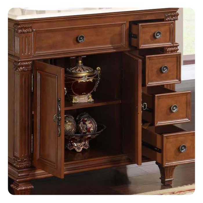 Ornate wooden cabinet with decorative drawers, open door revealing antique golden urn and ornamental spheres on shelves.