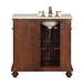 Antique-style wooden bathroom vanity with marble top, white sink, and brushed nickel faucet fixtures