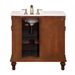 Wooden bathroom vanity with white marble top, antique brass faucet, and carved legs, featuring open storage compartment.