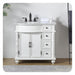 White bathroom vanity with black fixtures, ornate carved details, and four drawers on right side