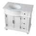 White bathroom vanity with marble top, two cabinet doors, and four drawers with decorative carved details and round sink