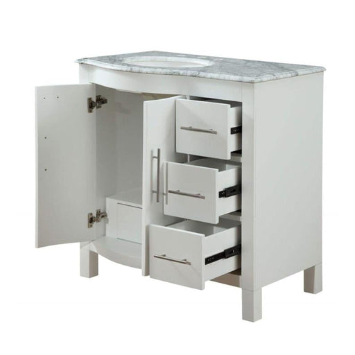 White bathroom vanity with marble top, open cabinet door and three pull-out drawers with metal handles.