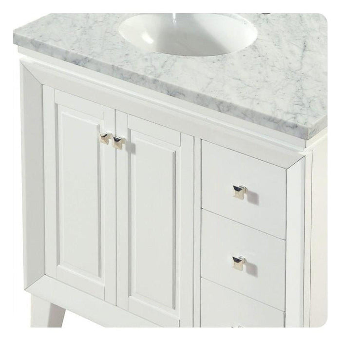 White bathroom vanity with marble top, two doors, two drawers, and silver hardware.