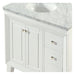 White bathroom vanity with marble top, two doors, two drawers, and silver hardware.