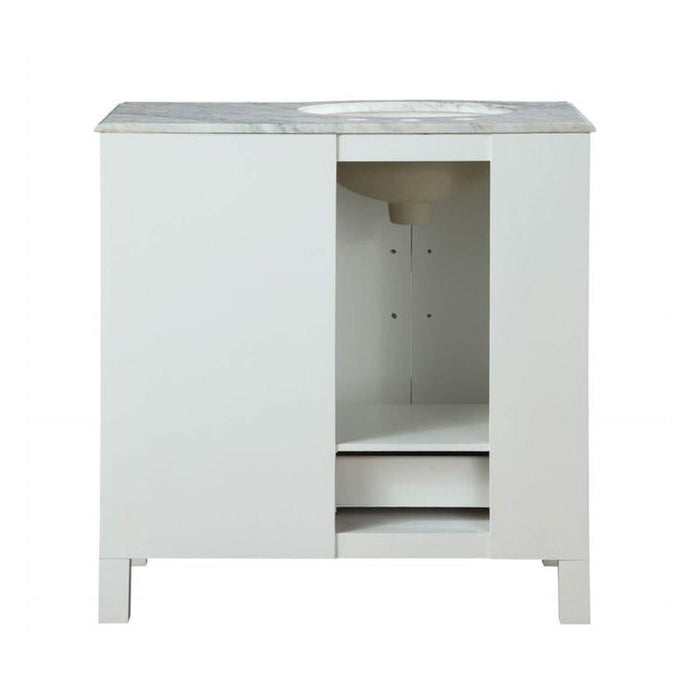White bathroom vanity with marble top, central open shelf, and two drawers on short legs