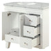 White bathroom vanity with marble top, open cabinet door, and three pullout drawers with small metallic knobs.