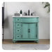 Mint green bathroom vanity with white marble top, three drawers, double doors, and black fixtures on a textured rug.