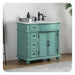 Vintage-style teal bathroom vanity with white marble top, black faucet, and decorative carved details on legs and sides.