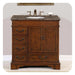 Traditional wooden bathroom vanity with marble top, undermount sink, and brushed nickel faucet; four drawers and double cabinet doors.