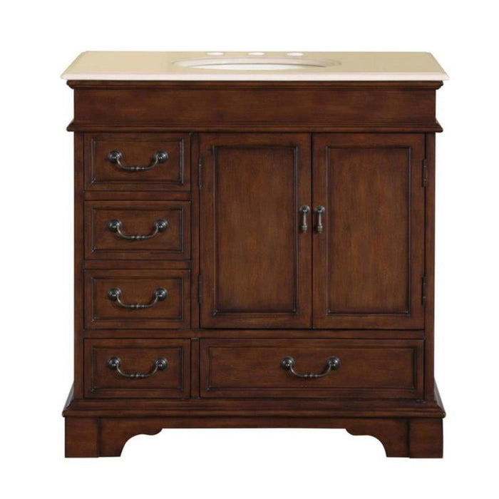 Dark wood bathroom vanity with marble top, four drawers on left, center cabinet doors, ornate metal handles