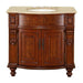 Ornate wooden bathroom vanity with curved front, carved details, and beige marble top with oval sink