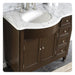 Dark wood bathroom vanity with white marble countertop and oval undermount sink, featuring brushed nickel faucet and hardware