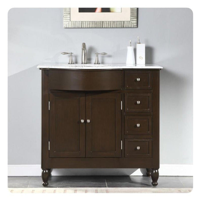 Dark wood bathroom vanity with white marble top, chrome faucet, and four drawers on right side.