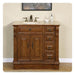 Wooden bathroom vanity with marble top, bronze faucet, and decorative carved details, featuring two doors and four side drawers.
