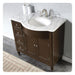 Dark brown bathroom vanity with marble top, undermount sink, and brushed nickel faucet.