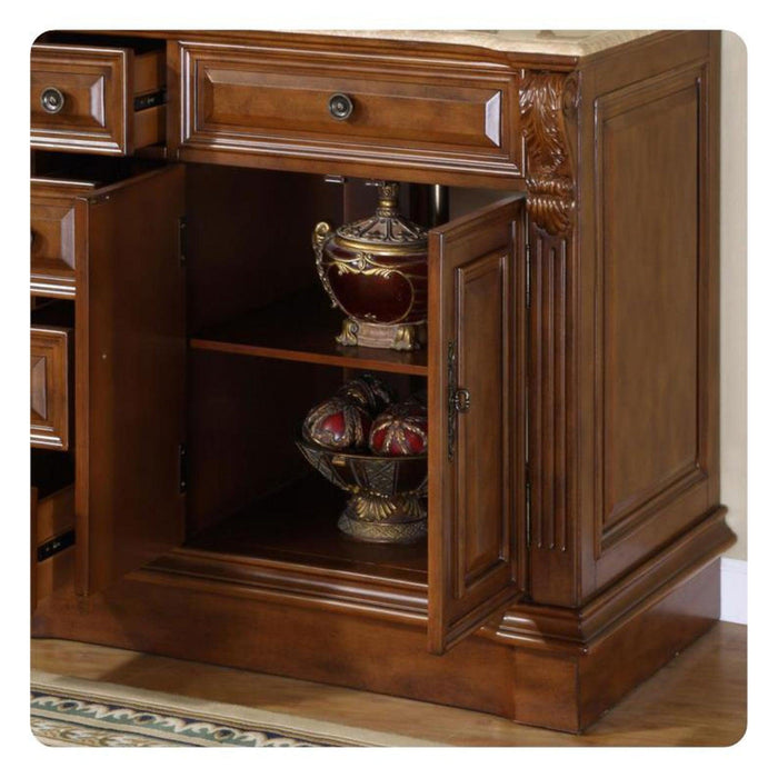 Ornate wooden cabinet with open door, displaying an antique golden urn and decorative spheres on dark wooden shelves.