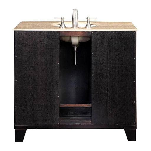 Dark wood bathroom vanity with travertine countertop and undermount sink, chrome faucet, storage cabinet below.