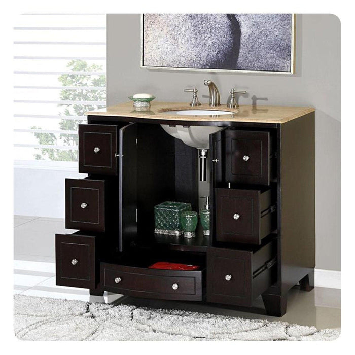 Dark wood bathroom vanity with multiple drawers, beige countertop, and undermount sink with chrome faucet