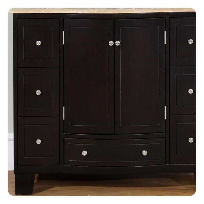 Dark wooden bathroom vanity with central double doors, bottom drawer, and six side drawers with round silver knobs, sitting on wooden floor.