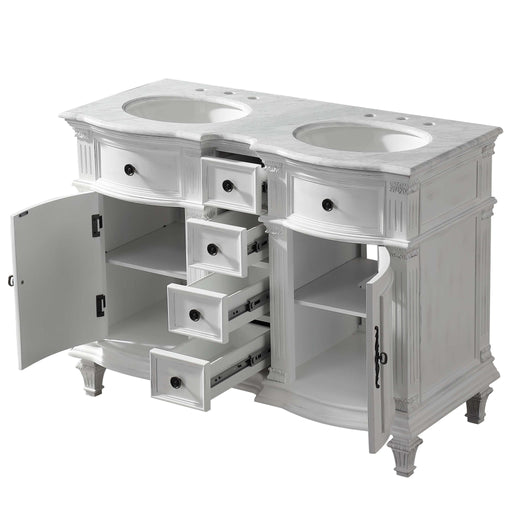 White double-sink bathroom vanity with ornate details, multiple drawers open to reveal storage space, marble top with oval sinks.