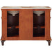 Reddish-brown bathroom vanity with two white sinks, decorative carved base, and open storage shelves.