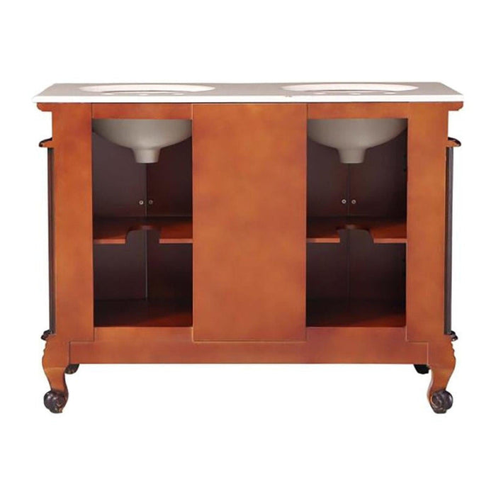 Double-sink bathroom vanity in warm orange wood tone with curved legs, white marble top and storage compartments.