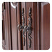 Ornate antique brass cabinet handles with scrollwork design on rich wooden cabinet doors, showing intricate vintage hardware.