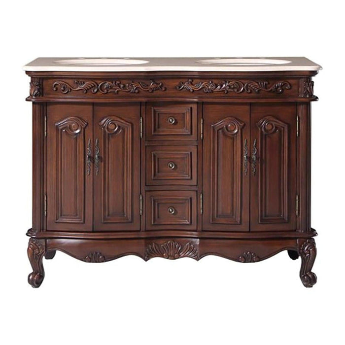 Ornate wooden bathroom vanity with curved legs, carved details, marble top, and two sinks