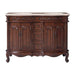 Ornate wooden bathroom vanity with curved legs, carved details, marble top, and two sinks