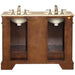 Double sink vanity with wood cabinet, stone countertop, and antique brass faucets and fixtures.