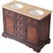 Rich mahogany bathroom vanity with travertine top, two oval sinks, four drawers, and decorative cabinet doors.