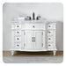 Elegant white bathroom vanity with six drawers, black fixtures, marble top, and ornate carved details on legs and columns.