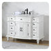 White ornate bathroom vanity with six drawers, marble top, and black fixtures, sitting on a textured rug.