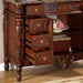Ornate wooden furniture with three open drawers, carved floral details, marble top, and decorative turned leg.