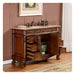 Ornate wooden bathroom vanity with carved details, marble top, open drawers, and sink with bronze fixtures.