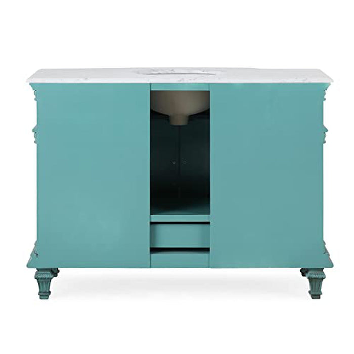 Teal bathroom vanity with white marble top, decorative legs, and center cabinet with open storage space