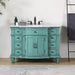 Vintage-style turquoise bathroom vanity with white marble top, six drawers, and black fixtures.