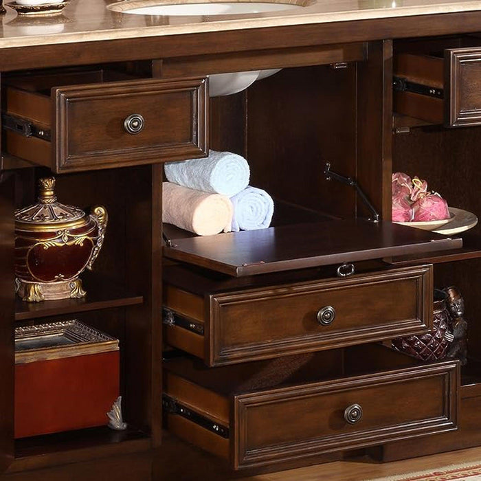 Rich wood bathroom vanity with open drawers, rolled white towels, decorative gold urn, and a pink accessory on side shelf.