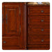 Rich cherry wood cabinetry with ornate handles, featuring a cabinet door and four drawers with decorative round brass knobs.