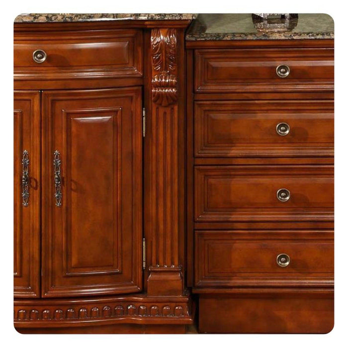 Rich wooden cabinetry with ornate carved details, decorative handles, and a marble countertop, featuring a cabinet door and multiple drawers.
