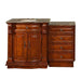 Rich cherry wood bathroom vanity with marble top, featuring ornate cabinet doors and four side drawers with decorative hardware.