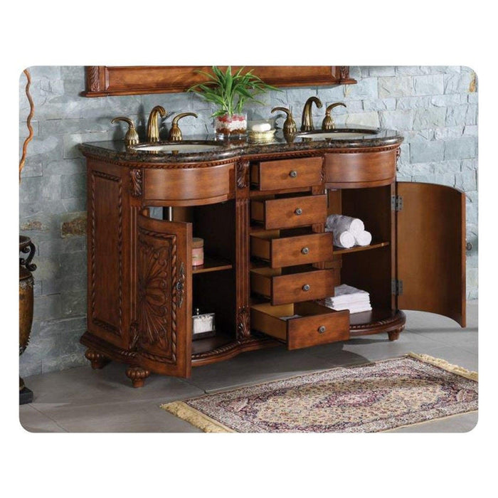 Elegant wooden bathroom vanity with marble top, ornate carved details, two sinks, multiple drawers, and gold fixtures against stone wall.