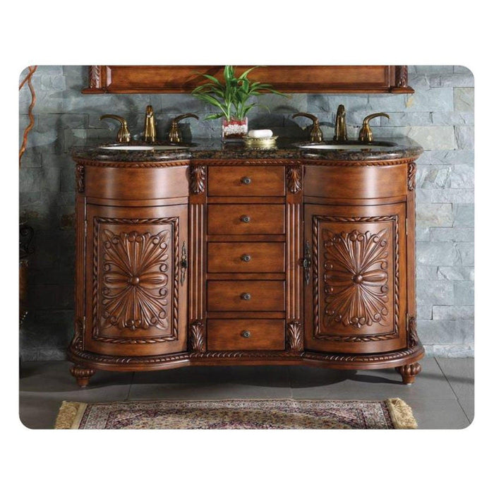 Ornate wooden bathroom vanity with double sinks, marble top, carved floral details, and brass fixtures against stone wall