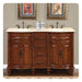 Elegant wooden double vanity with marble top, bronze fixtures, two sinks, decorative urns in framed artwork above