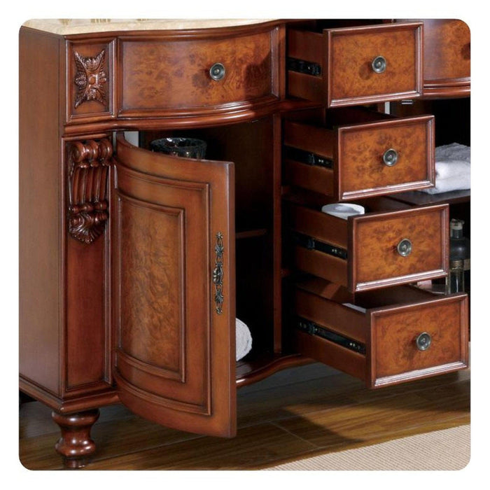 Ornate wooden bathroom vanity with curved door, decorative carved details, and multiple open drawers revealing storage space.