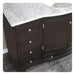 Dark brown bathroom vanity with marble countertop, four drawers, and a cabinet door with decorative silver knobs.